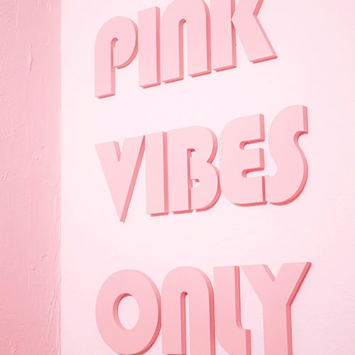 'Pink Vibes Only' pink text on a pink wall - Gabrielle Henderson on Unsplash