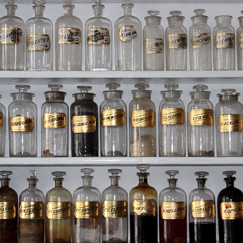 Photo of three rows of labeled glass jars on three shelves - Matt Briney on Unsplash